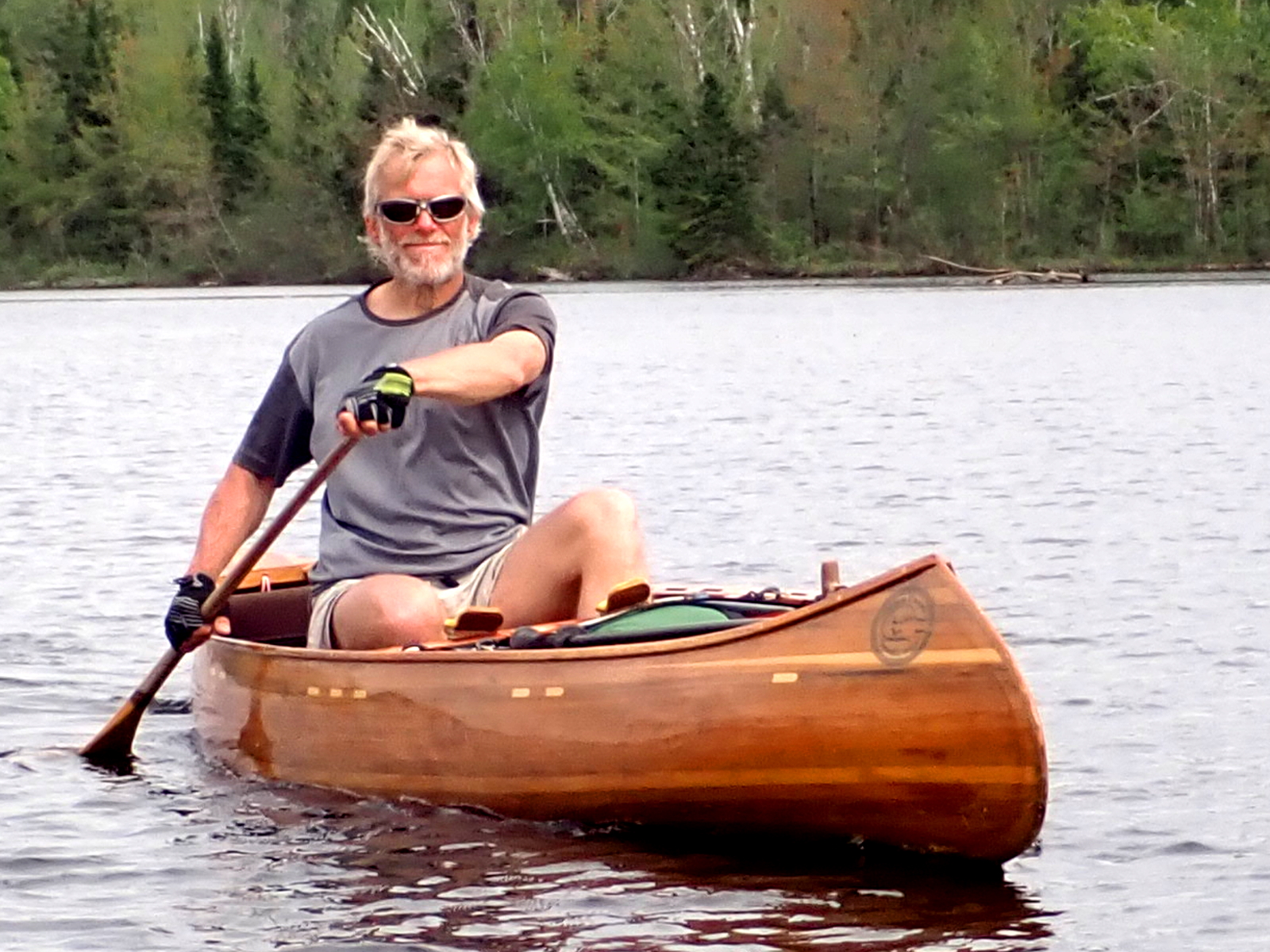 Peter Macfarlane paddling a self-built cedar-strip canoe